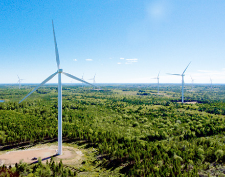 Wind Turbine Against A Green Landscape