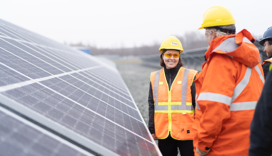 workers-infront-solar-panels